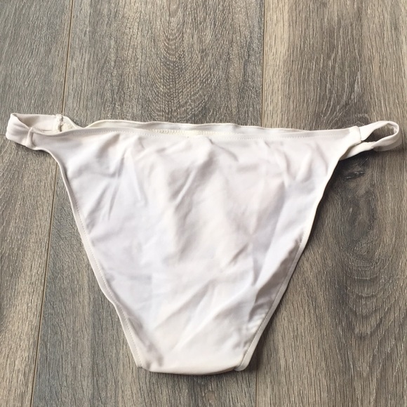 8/15 White bikini bottoms with gold emblem - Picture 2 of 4